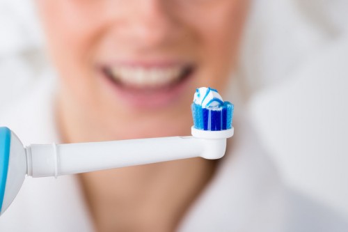 Electric toothbrush with toothpaste