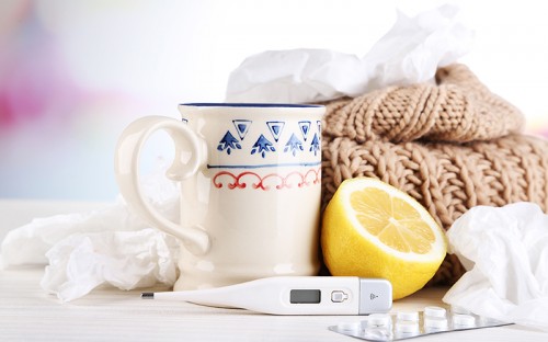 mug, lemon and thermometer on the table