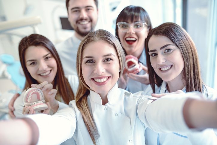 Happy Dentist taking selfie